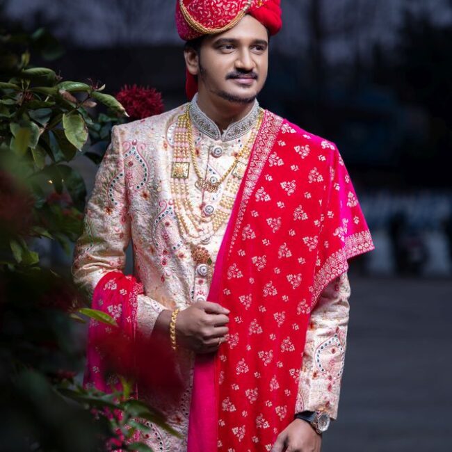 Premium Photo | Indian Bride and groom posing on their wedding Indian groom  in white Sherwani bride in dark red le