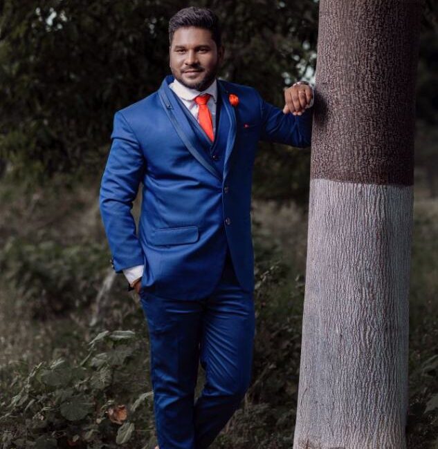 Reception groom poses